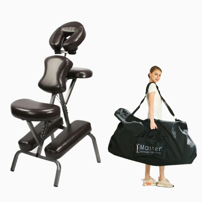 A woman carrying the folded Master Massage Bedford chair inside its black carrying case with shoulder strap.