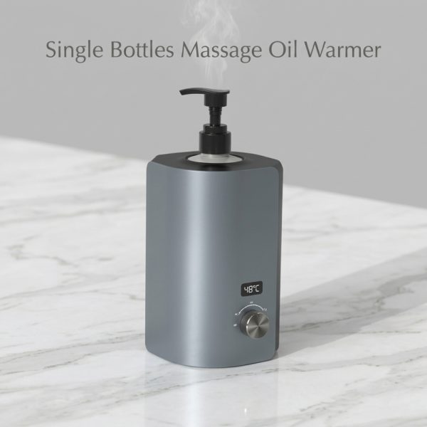 Professional Single Bottle Massage Oil Warmer on a white marble countertop with subtle steam rising from the pump.