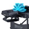 A close-up of the headrest and top section of a black portable massage table, showing blue glowing airbags activated to demonstrate the 3D lumbar traction feature.