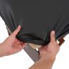 Close-up of hands stretching a black elastic fitted PU leather cover over a massage table corner