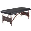 Black Master Massage universal fitted PU vinyl leather cover installed on a wooden table.